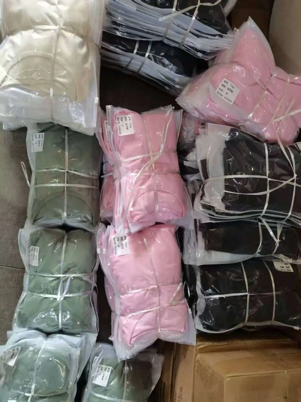 Clothing batches in colourful polybags packed and ready to ship from a warehouse in China