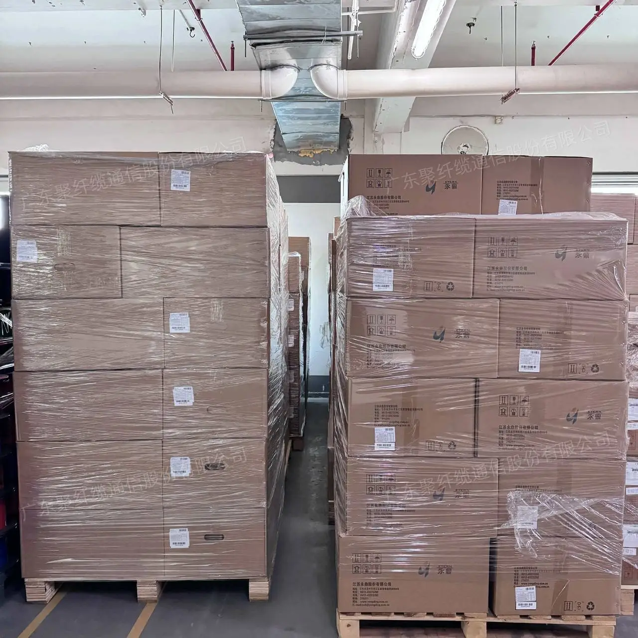 Pallets of cartons with optical fibre at a manufacturer's warehouse before dispatch from China